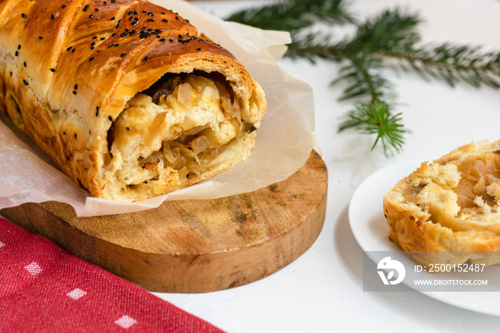 Kulebiak - a dish of Russian cuisine made of yeast dough stuffed with sauerkraut