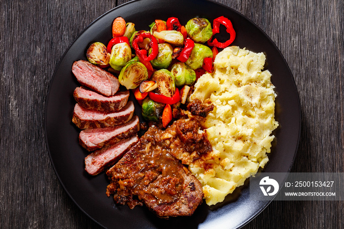 beef steak with potato mash and roasted vegetables