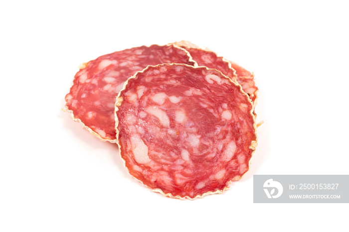 Slices of salami sausage on a white background