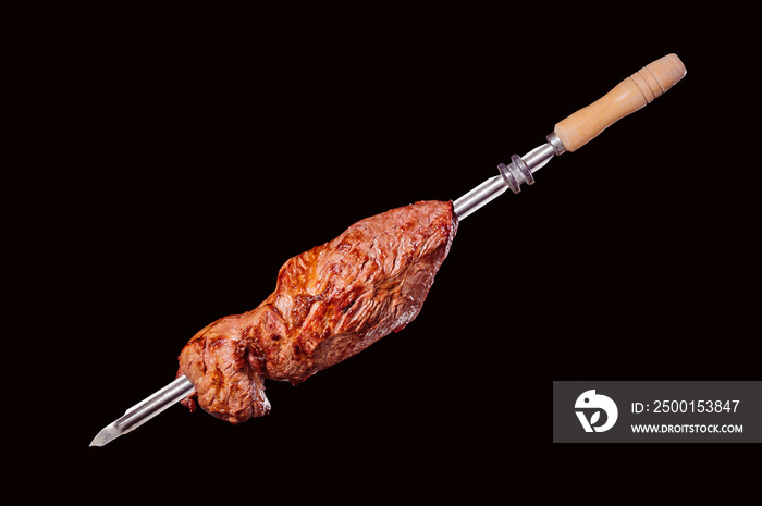 A brazilian traditional barbecue grilled ox termite on the stick - Cupim no espeto