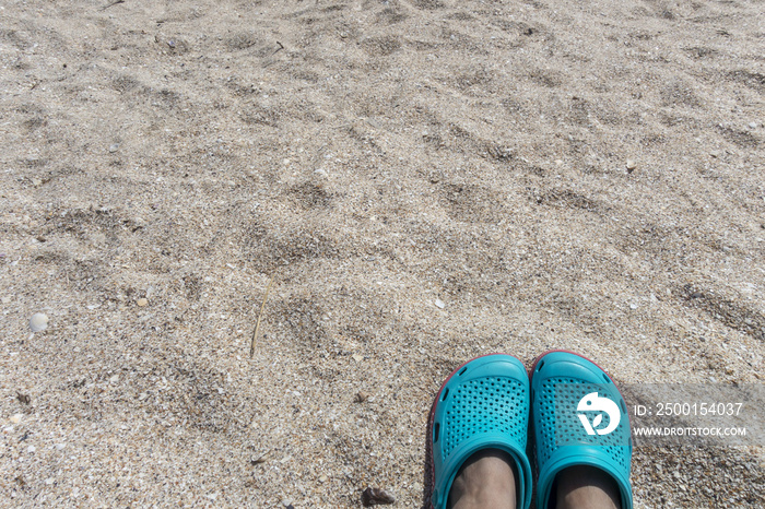 Blue sandals on the beach