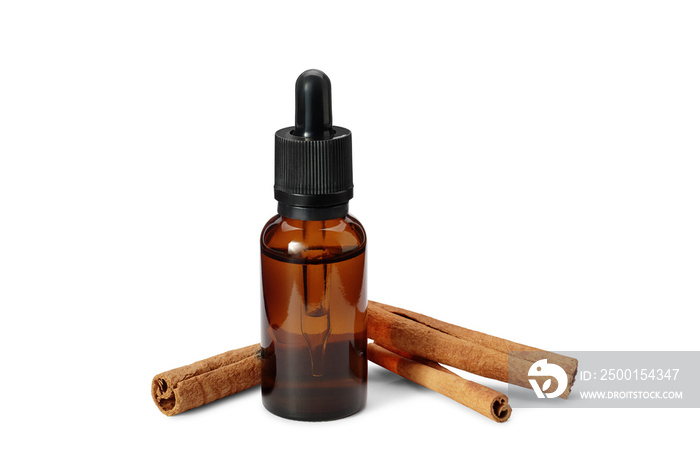 Brown bottle with pipette of organic essential oil and cinnamon sticks isolated on white background