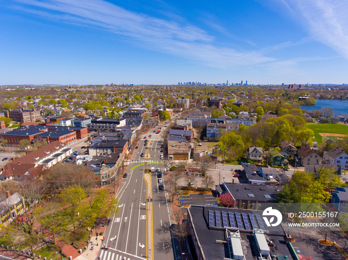 Arlington historic town center aerial view on Massachusetts Avenue at Mystic Street and Broadway with Boston at the background, Arlington, Massachusetts MA, USA.