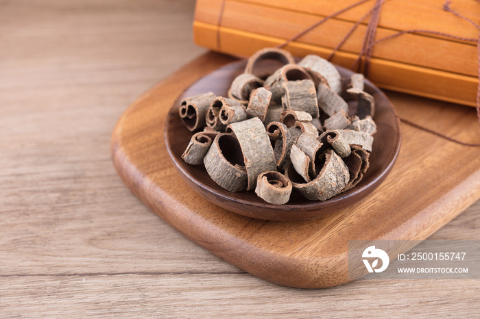 A plate of Chinese medicine Magnolia officinalis on a cutting board