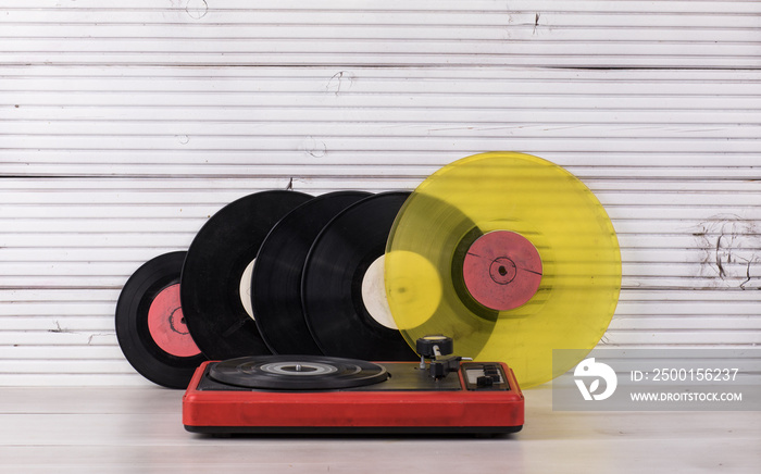 vintage turntable on white wooden background