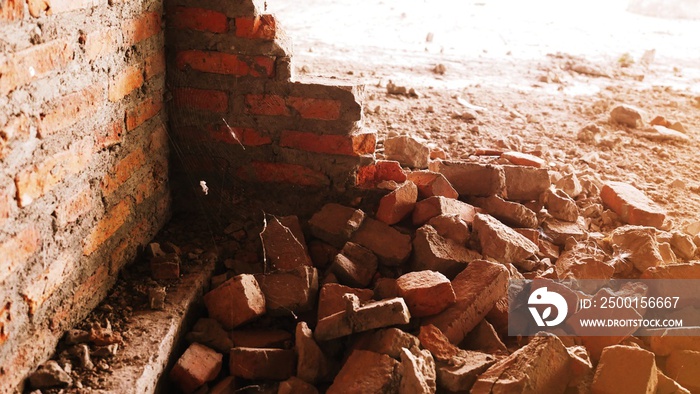 Close-up of the rubble of an industrial building collapsing into a pile of concrete and brick. and the jagged debris caused by the failure of the engineers at the abandoned construction.