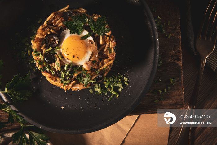 Portuguese cuisine - Frango a Bras. Traditional Portuguese dishes, based on sautéed chicken with onion, garlic, parsley, olives, egg and potatoes chips. A variation of the traditional Bras cod dish