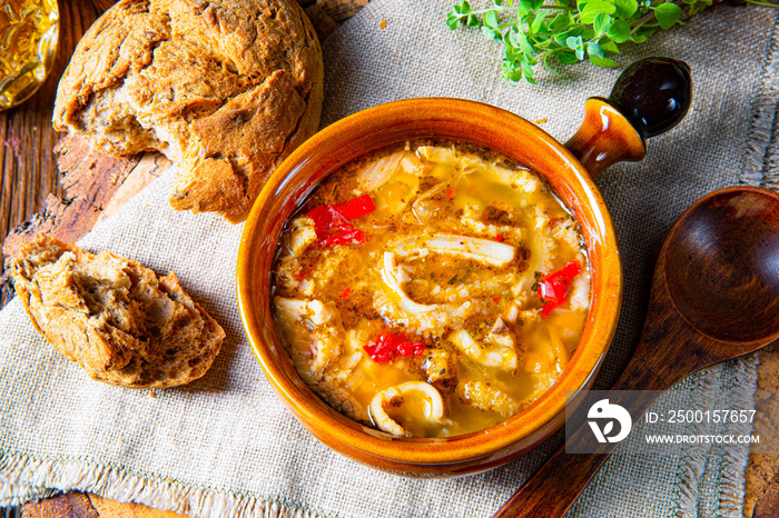 Spicy tripe soup with red paprika.