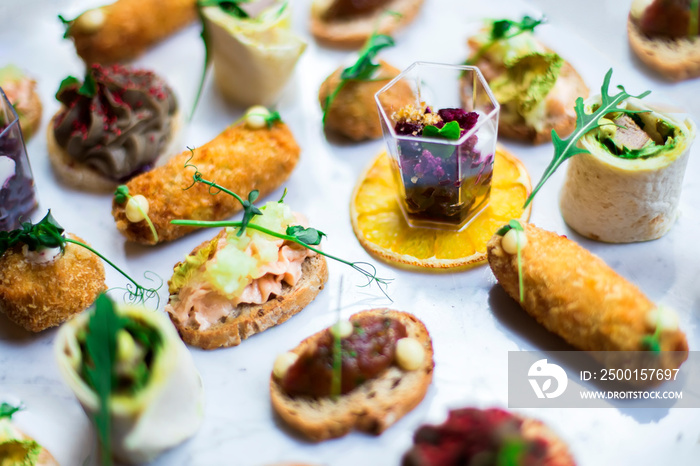 Appetizers table with different antipasti snacks