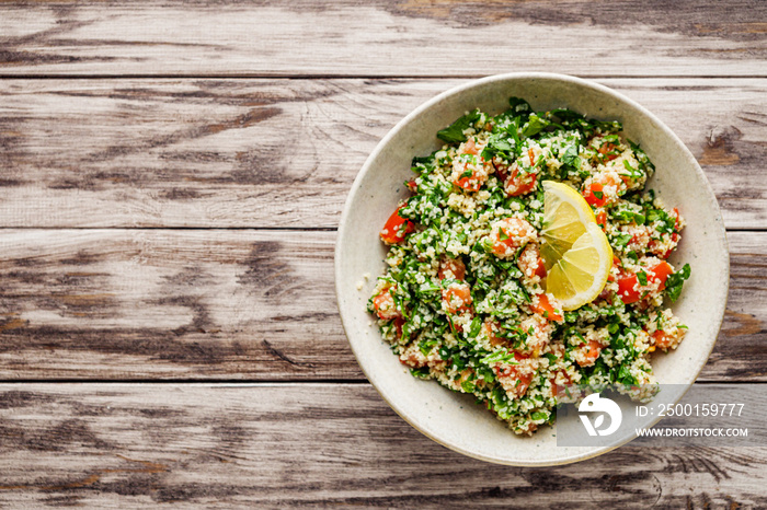 arabic salad tabbouleh on a rustic wooden background