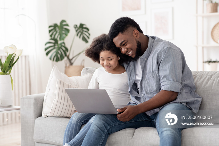 Online School Applications. African American Father And Daughter Using Laptop At Home