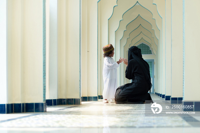 Muslim mother teach her son praying, relationship between Muslim mother and child