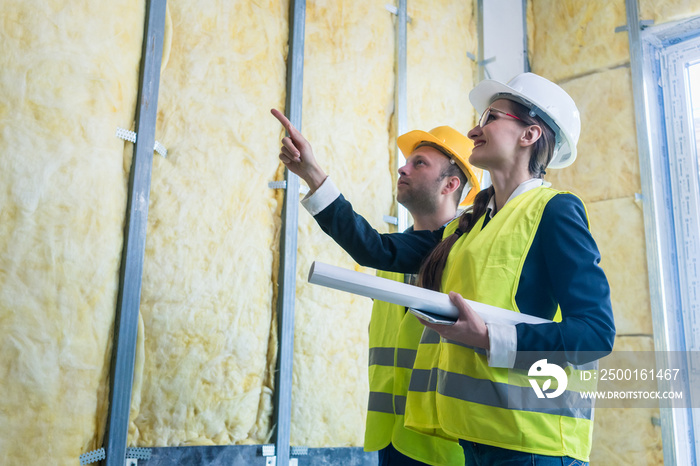 Construction manager and architect checking the insulation works