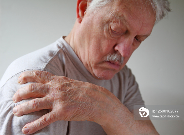 Shoulder joint pain on an older man