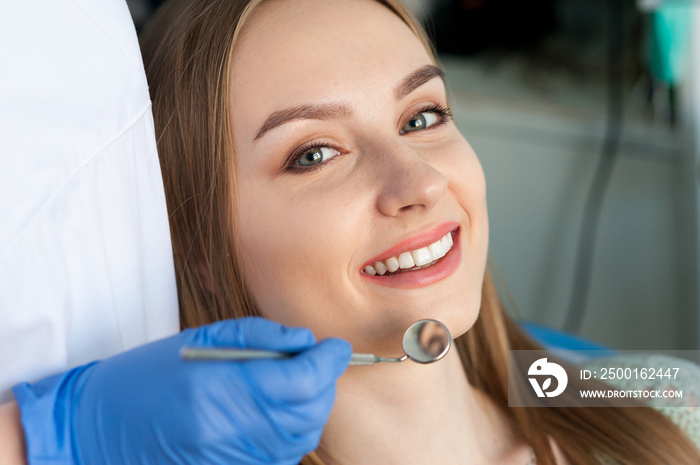 Dentist examining a patient’s teeth