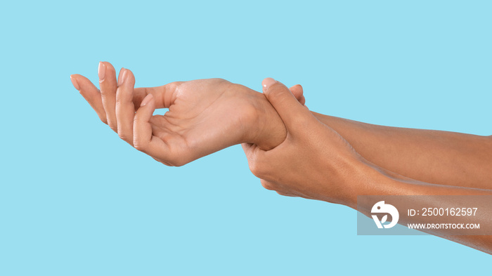 Closeup cropped of young woman showing her hands, self massage