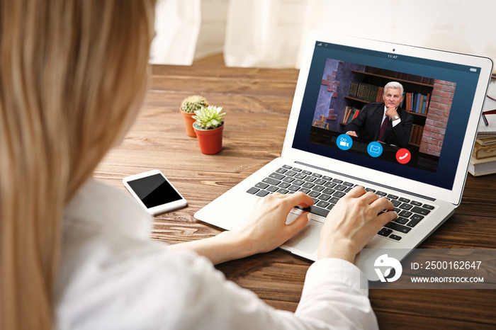 Woman video conferencing with lawyer on laptop. Video call and online service concept.