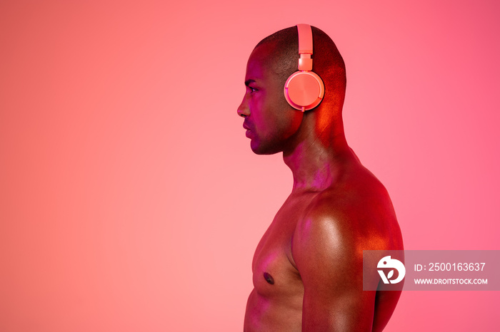 Man posing isolated while listening music