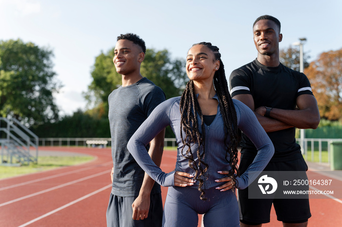 Portrait of group of athletes standing at stadium