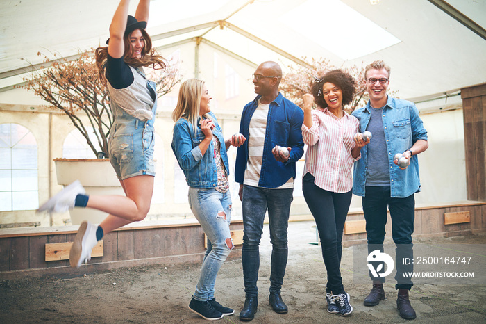 Happy multiracial men and women on petanque court