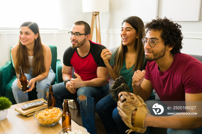 Group of friends enjoying watching the baseball world cup on tv