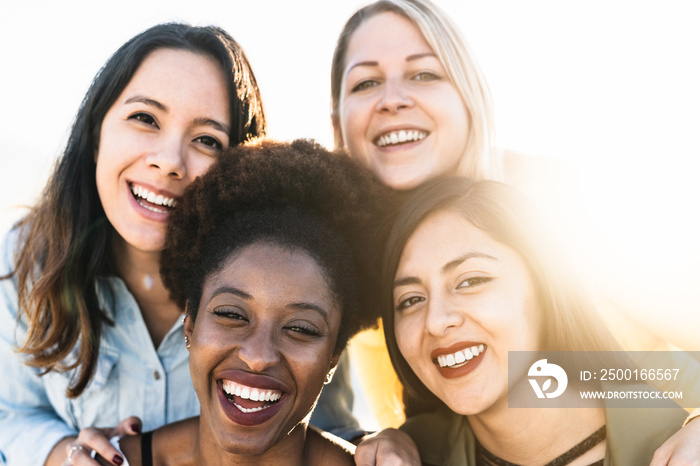 Portrait of happy multiracial women having fun outdoor