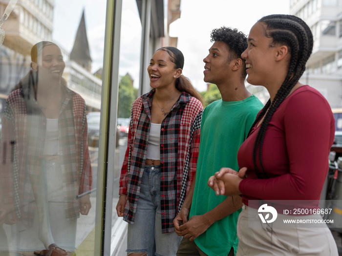 Friends looking at window display