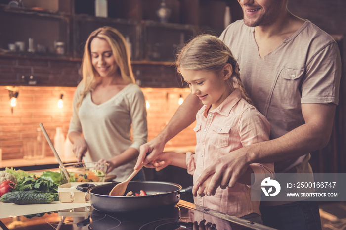 Young family cooking