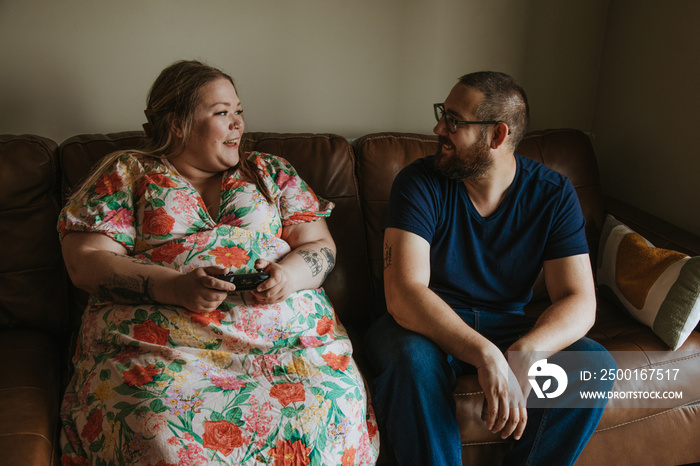 couple watching tv and talking