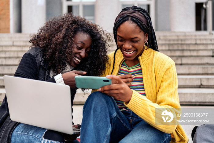 Cool Afro Girls Using Phone