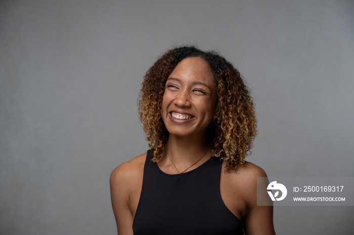 Portrait of smiling woman with curly hair