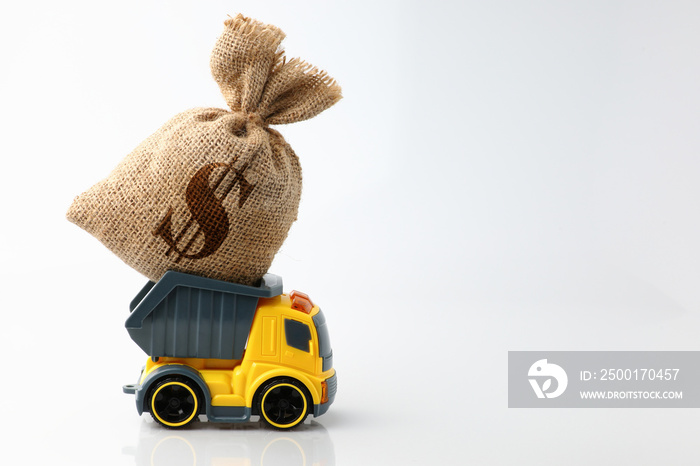 The yellow truck delivering carrying a bag of money on the pickup isolated on a white background. Concept business and financial.