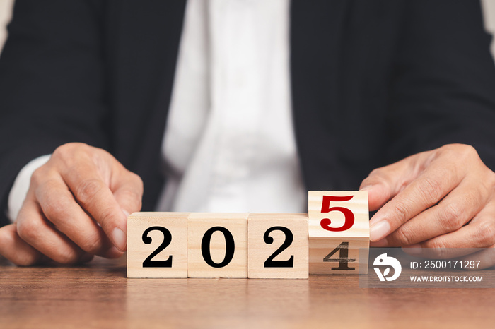 Flipping of 2024 to 2025 on wooden cubes for preparation of new year change