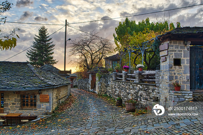 Sunset on a traditional alley in Megalo Papingo village in Ioannina, Greece