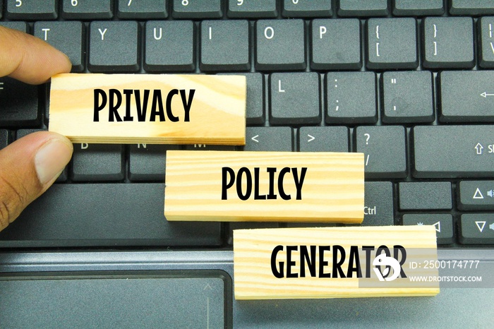 laptop keyboard and wooden board with the word privacy policy generator