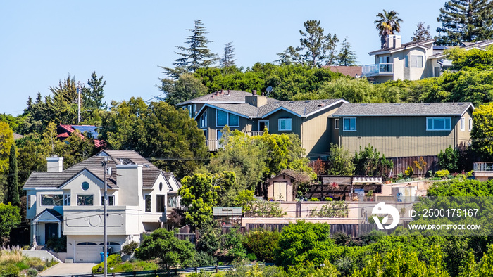 Exterior view of houses located in a residential neighborhood; Redwood City; San Francisco bay area, California