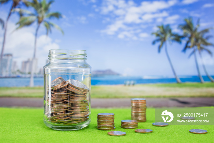 Coins in bottle with island background use for travel programe