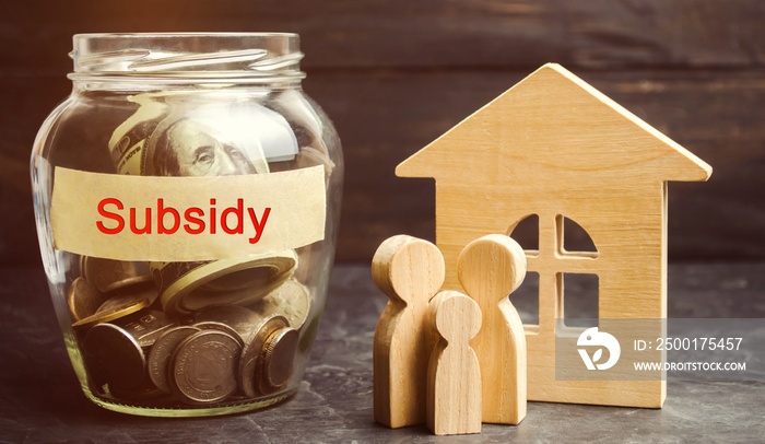 The family is standing near a glass jar with the inscription Subsidy. Financial aid, support to the population. Cash grants, interest-free loans. Tax breaks, insurance, low-interest loans