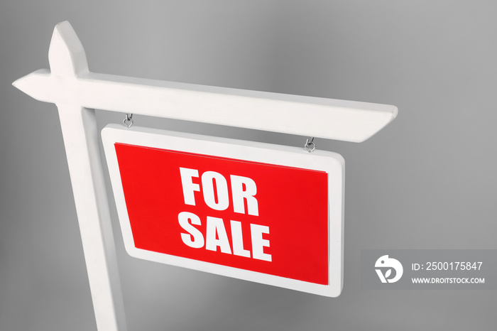 For sale  sign on grey background