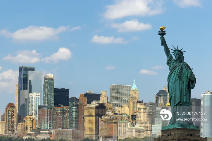 The Statue of Liberty with the hudson river and New York cityscape landmarks of lower Manhattan New York city.