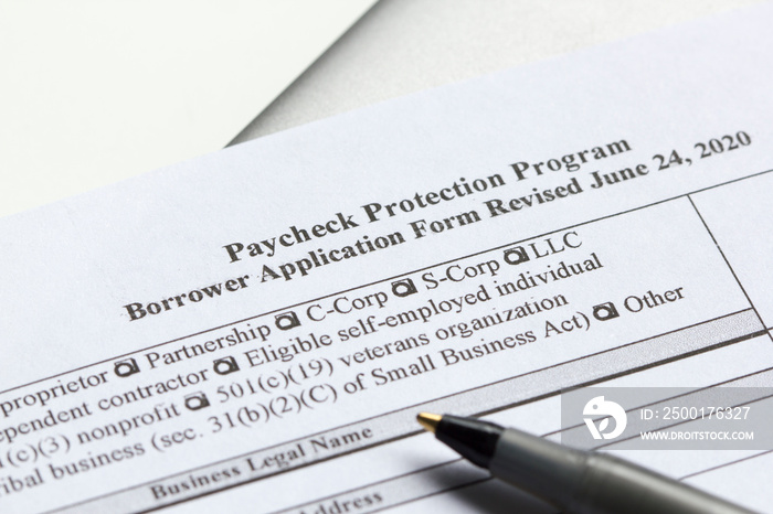 Closeup of the Paycheck Protection Program (PPP) Borrower Application Form. PPP loan is meant to provide an incentive for small businesses to keep their workers on the payroll.