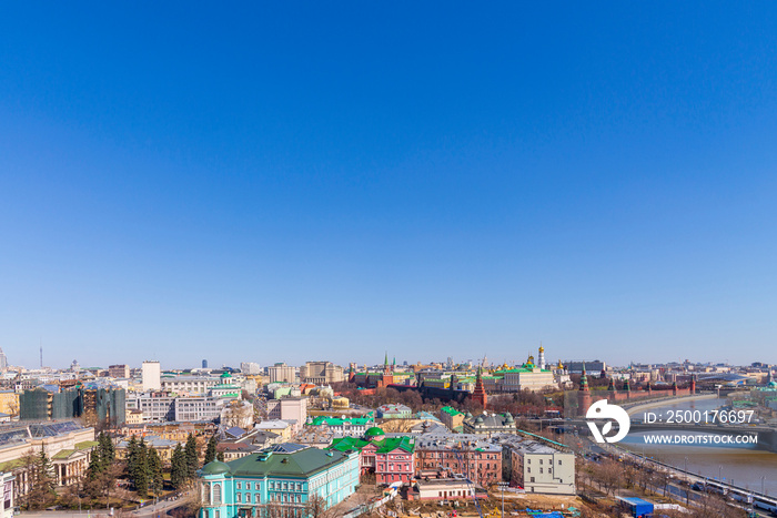 View of Moscow Kremlin and the bell tower of Ivan the Great and Russian weapons with moscow cityscape, Moscow, Russia