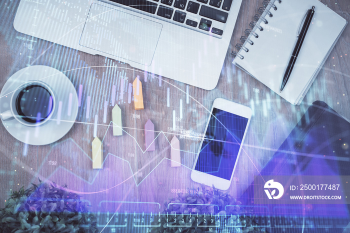 Double exposure of financial chart hologram over desktop with phone. Top view. Mobile trade platform concept.