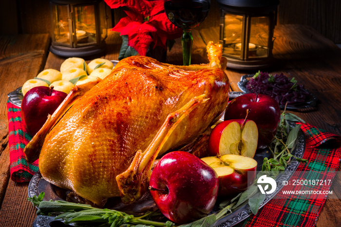 festive stuffed roast goose with red cabbage and dumplings