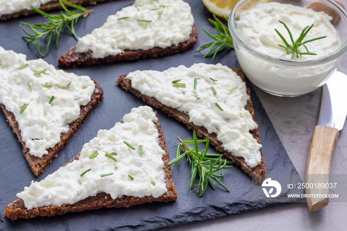 Pumpernickel bread with feta, cream cheese, rosemary, lemon, garlic dip