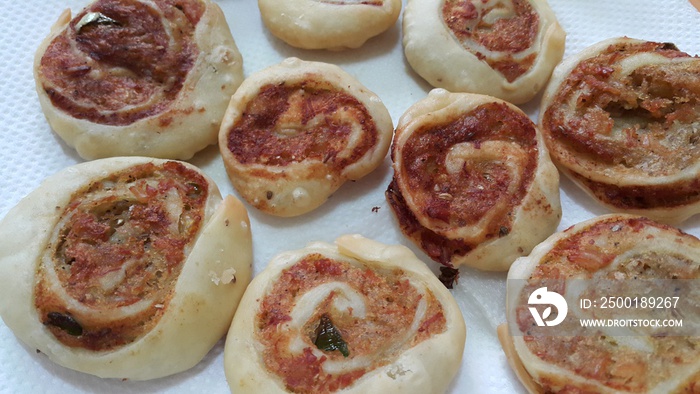 Closeup of delicious home made pinwheel puff pastries food on white background