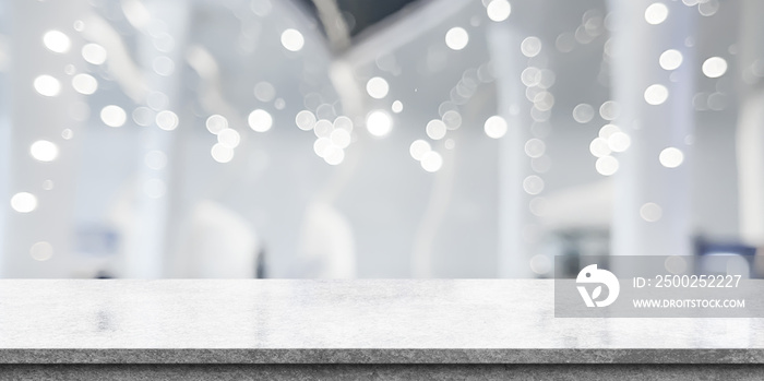 Empty white marble stone table top and blur interior cafe and restaurant.