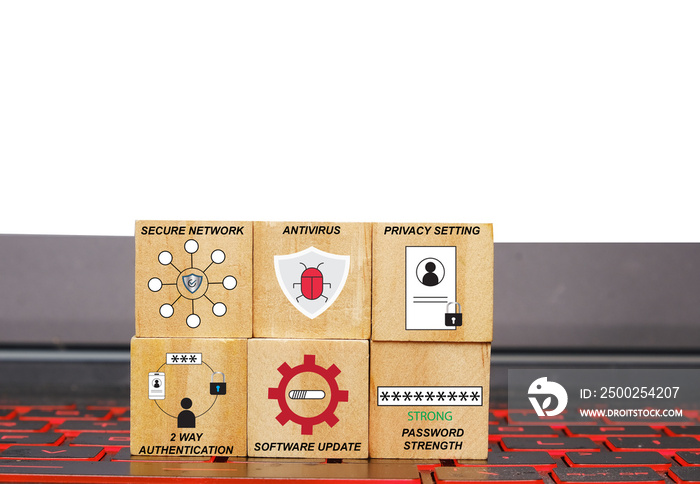 A picture of wooden block with icon to improve cybersecurity threat on laptop keyboard