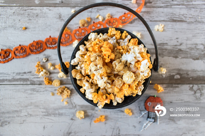 Halloween popcorn in cauldron top view