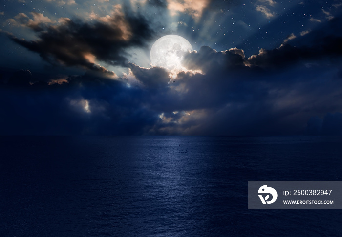 Night sky with moon in the clouds  Elements of this image furnished by NASA